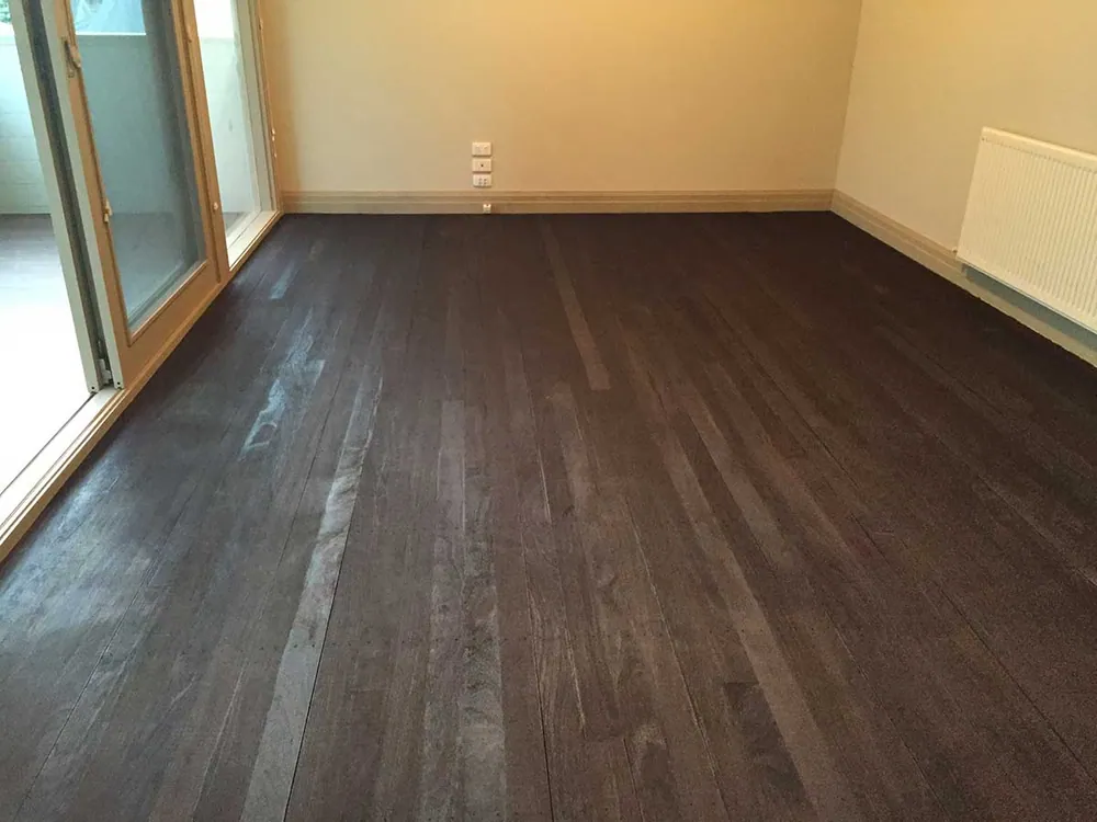After Teak Brown Feast Watson direct stain with a water-based satin finish timber floor, Gold Coast