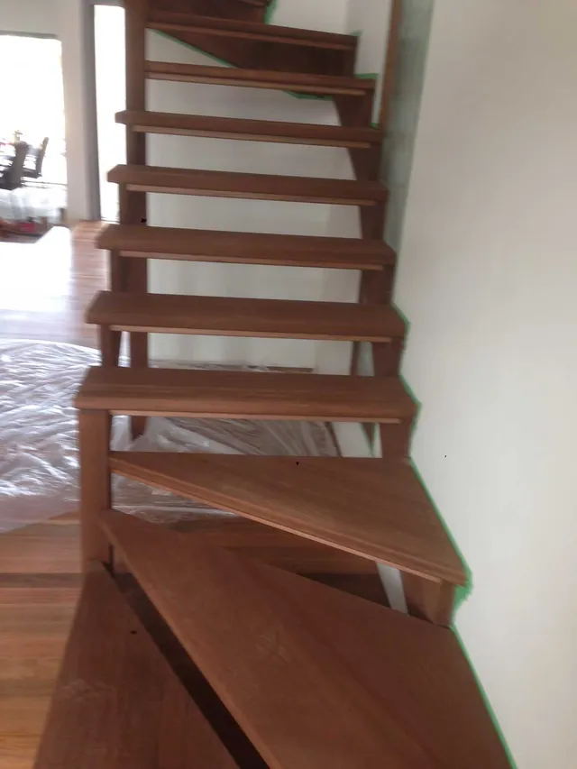 Open flight timber stairs with a walnut direct stain and polyurethane satin finish