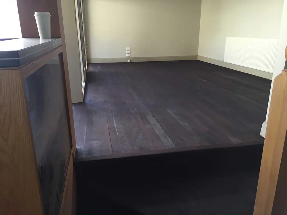 Teak Brown Feast Watson direct stain with a water-based satin finish timber floor, Gold Coast